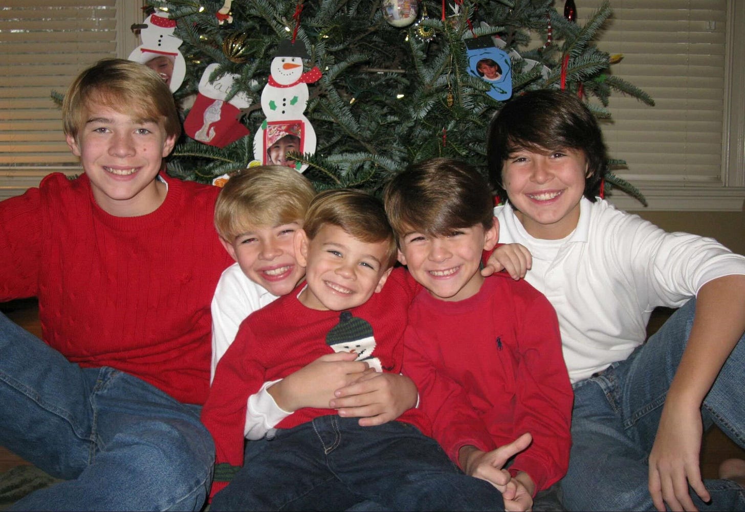 Photo of the five Lanzi brothers in front of a Christmas tree. Photo of the five Lanzi brothers in front of a Christmas tree.