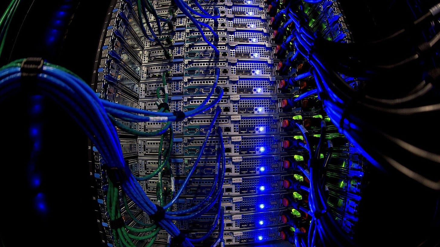Blue wires connecting to servers with blue and green lights