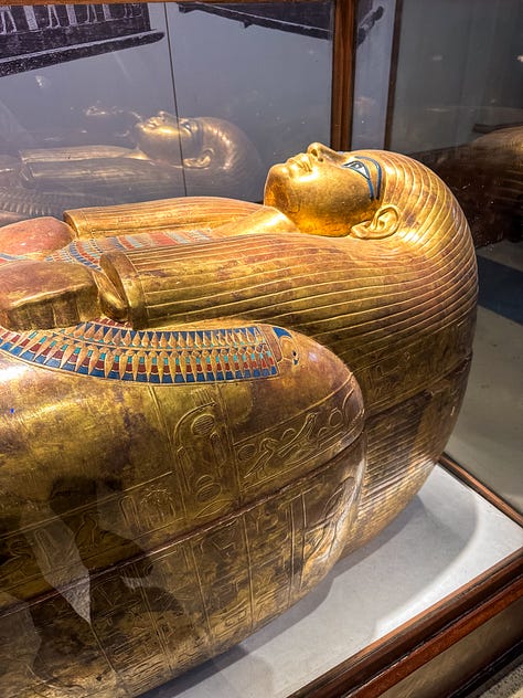 3 photos: 1 of a golden sarcophagus in the Egyptian museum, 1 of a beautiful bedroom on a nile sailboat where you can see the water through the window, and 1 of Anela standing smiling in the foreground with the pyramids in the background.