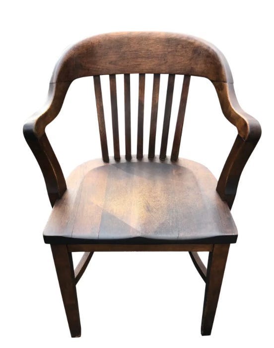 A wooden chair with a white background

AI-generated content may be incorrect.
