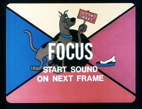 Opening slides of several educational filmstrips. Yogi Bear in "Play it Safe," The Flintstones in "A Weighty Problem," "Bamm-Bamm Tackles a Term Paper," The Jetsons "Down to Earth Nutrition," The Flintstones "Driving Guide," Jabberjaw in "The Silent Hunters," "Around the World Kids Visit Saitama, Japan," Scooby Doo in "Let's Go to Press Part II: News Reporting"