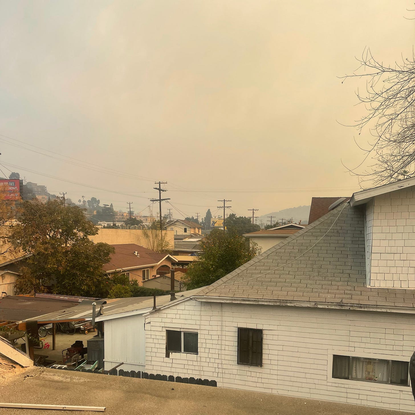 The view from my second story window of the smoke-filled sky.