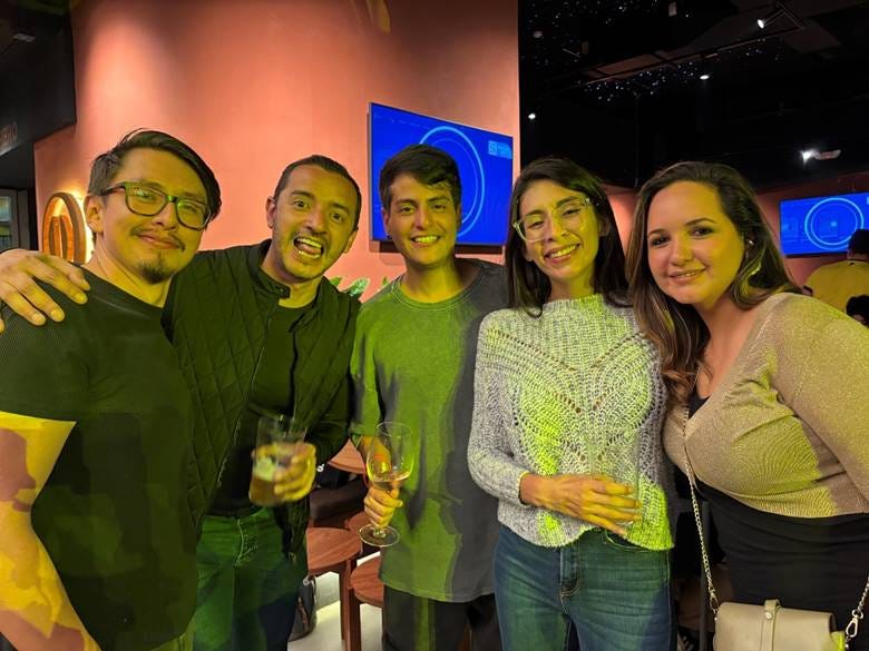 A group of people posing for a photo

AI-generated content may be incorrect.