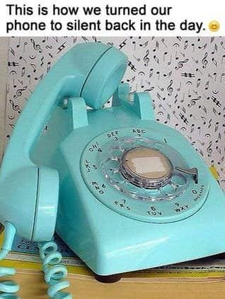 May be an image of phone and text that says 'This is how we turned our phone to silent back in the day. TIHY ง WXY'