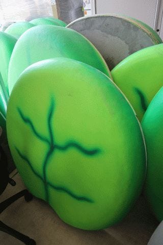 A stack of green lily pads from a recreation center's pool