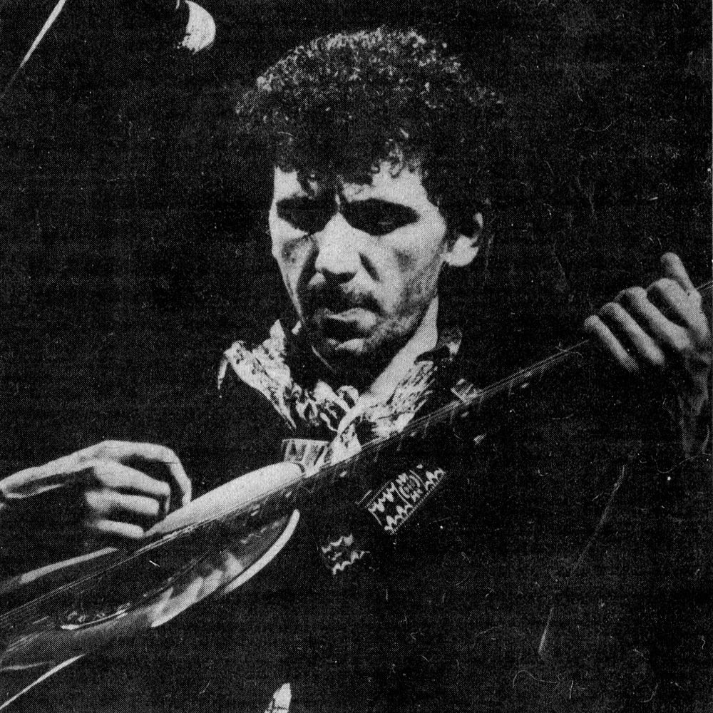 Close-up photo of Kevin Rowland on stage.