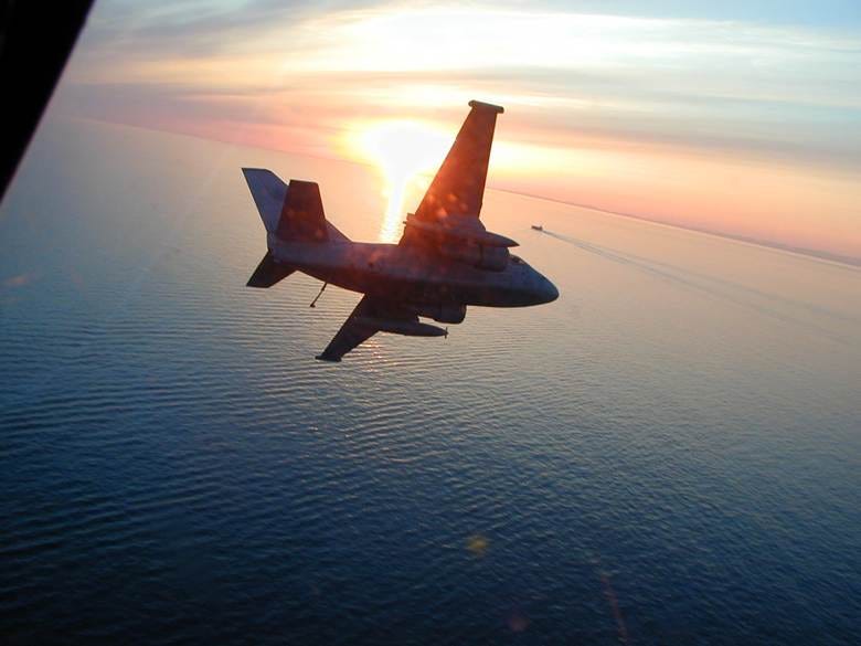 A plane flying over the ocean