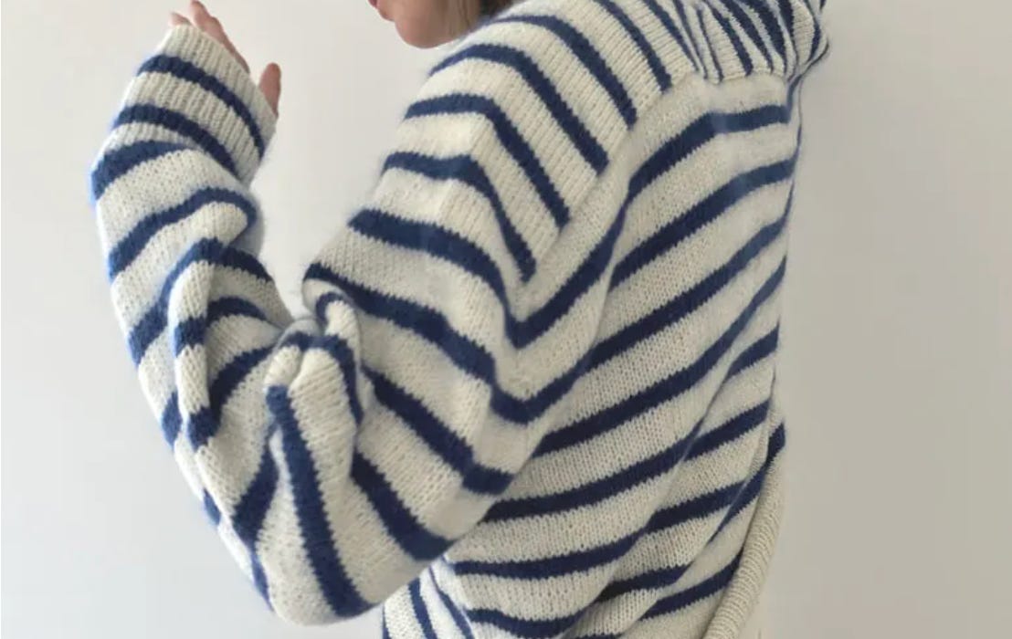 Handknit sweater in blue and white stripes Handknit sweater in blue and white stripes