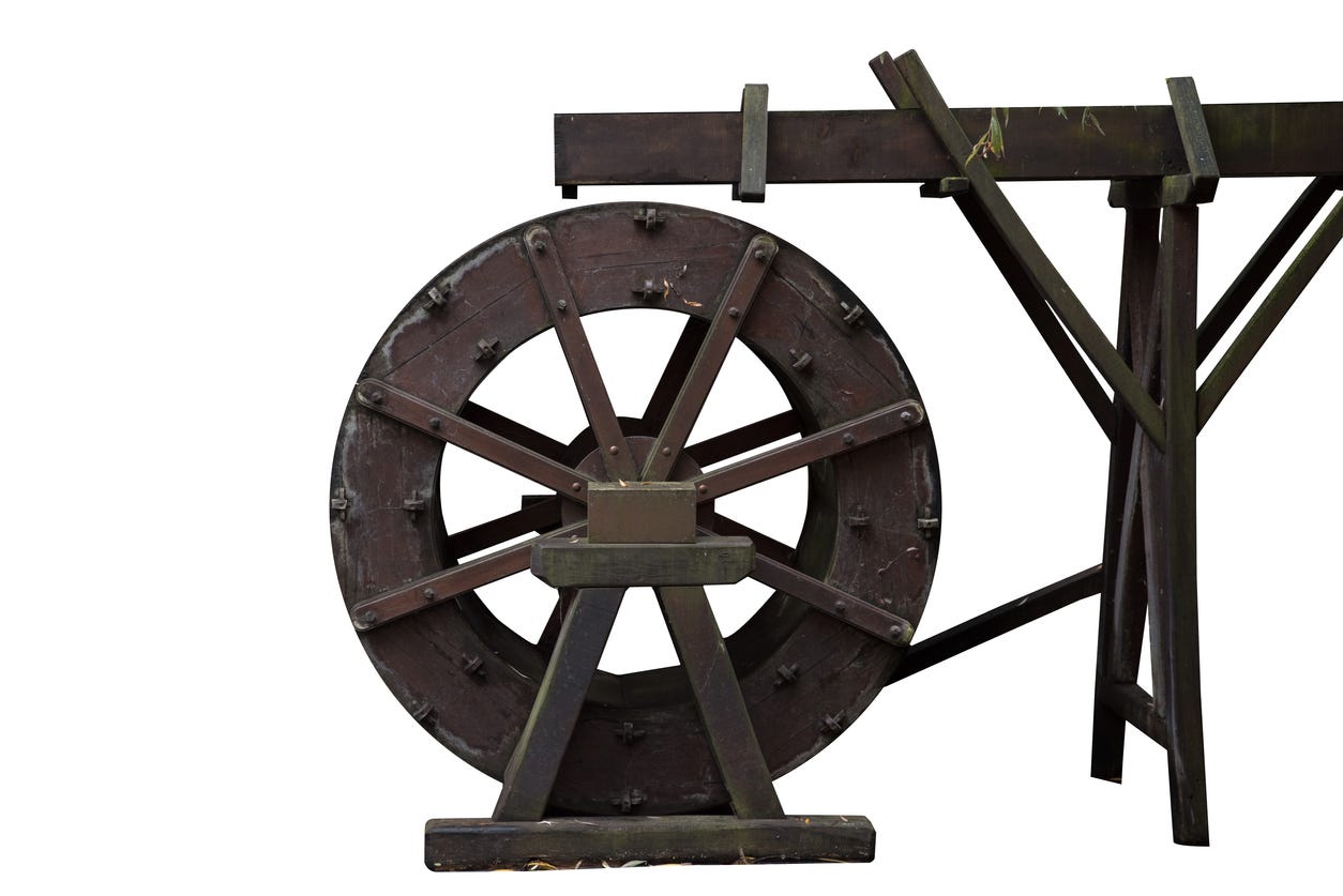 Overshot water wheel - Weight of water coming down from the top drives wheel around, rather than pressure from waterflow. Overshot water wheel - Weight of water coming down from the top drives wheel around, rather than pressure from waterflow.