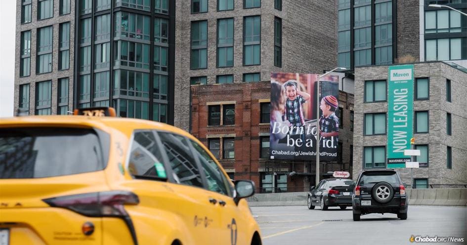 This summer, over 80,000 daily commuters crossing the Third Avenue Bridge toward the FDR Drive in New York City will pass the “Born to Be a Yid” billboard advertisement.