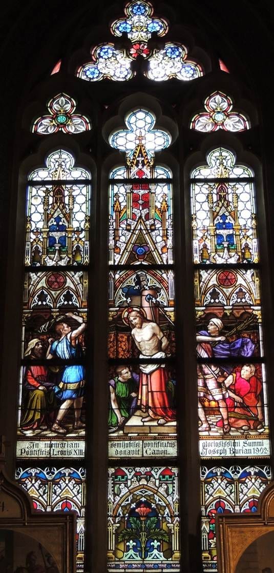 A stained glass window in a church

AI-generated content may be incorrect.