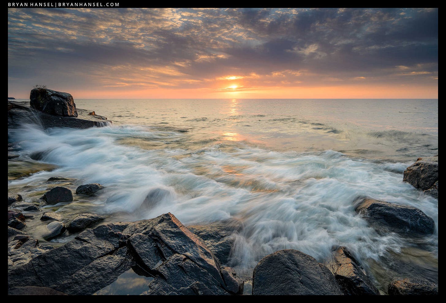 Waves wash up onto a basalt shoreline. Waves wash up onto a basalt shoreline.