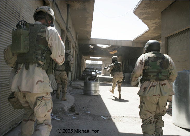 LTC Erik Kurilla (front right), the moment the bullets strike.(2nd LT front-left; radioman near-left; “AH” the interpreter is near-right.) LTC Erik Kurilla (front right), the moment the bullets strike.(2nd LT front-left; radioman near-left; “AH” the interpreter is near-right.)