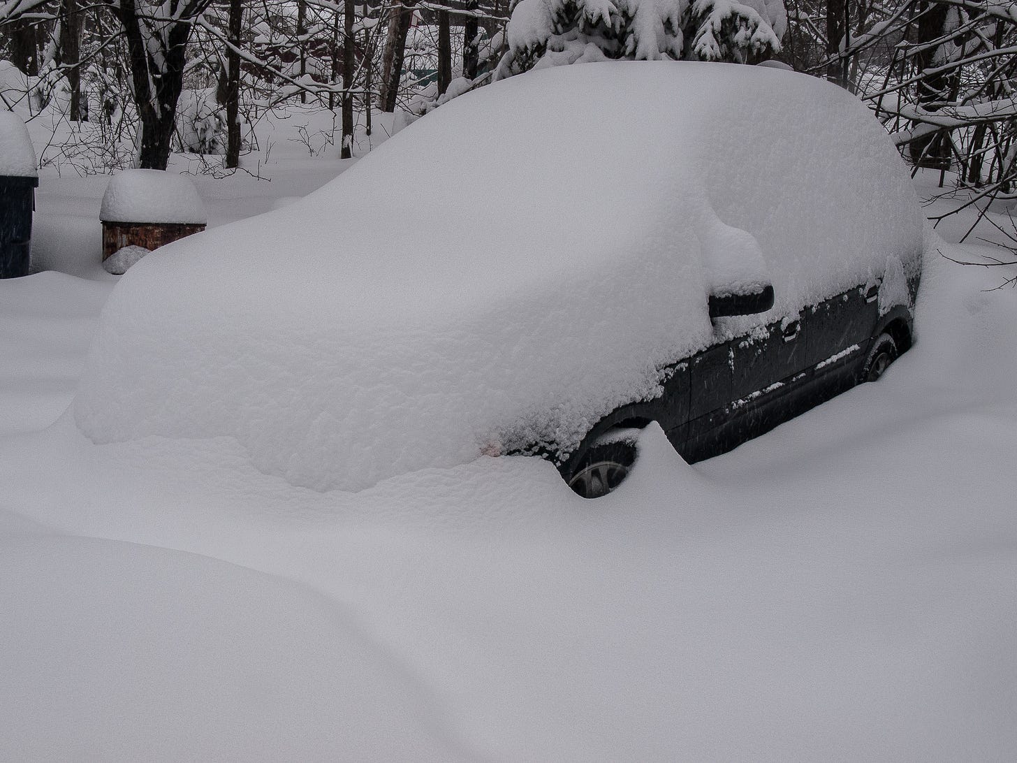 Car buried in snow