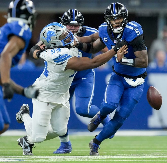 Detroit Lions defensive tackle Alim McNeill (54) causes Indianapolis Colts quarterback Anthony Richardson (5) to fumble the ball.