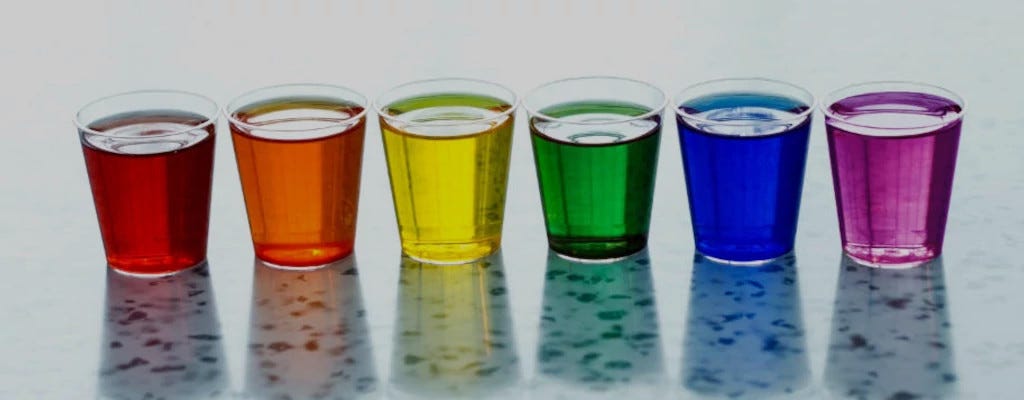 Glasses with different liquids inside.