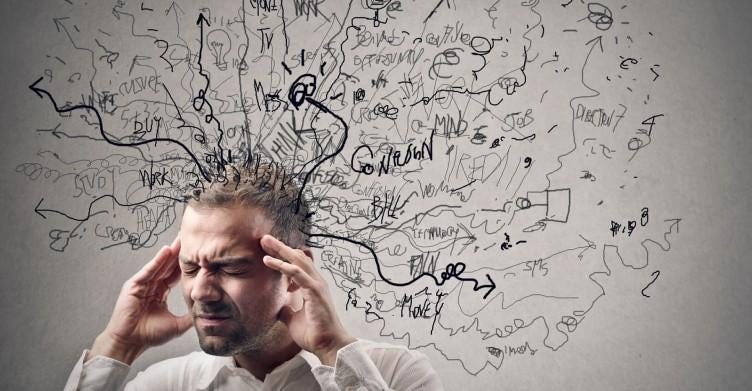 A person with his hands on his head

Description automatically generated