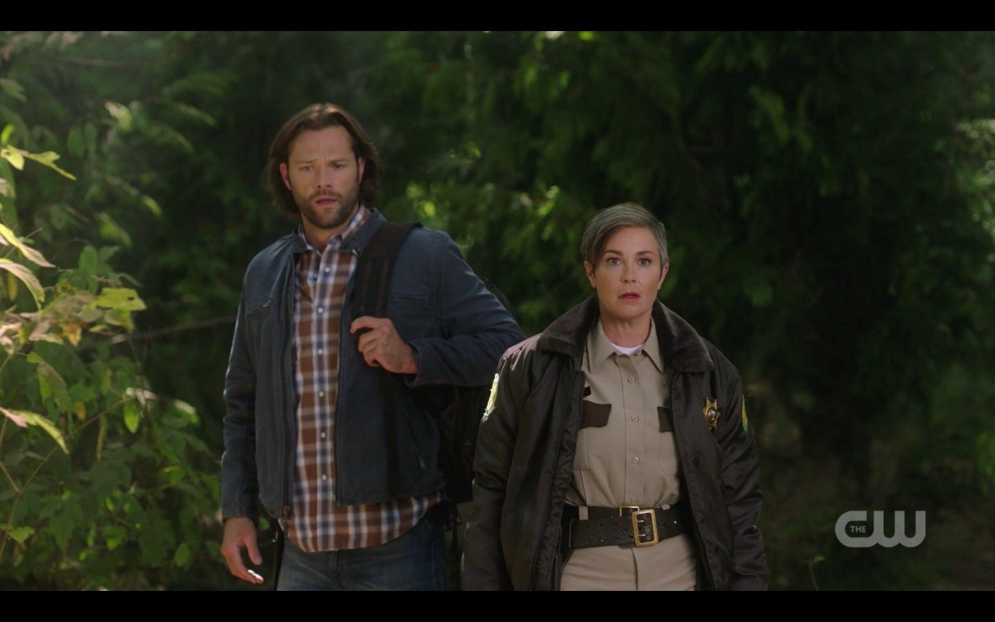 sam winchester with jody in woods supernatural scar