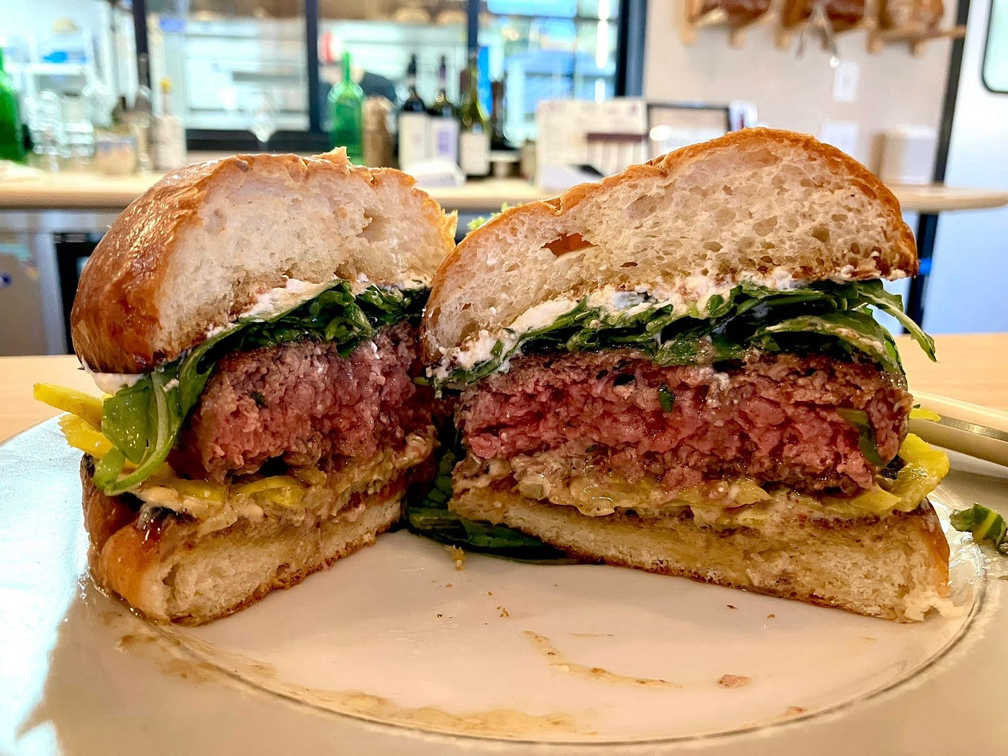 May be an image of burger and chicken sandwich