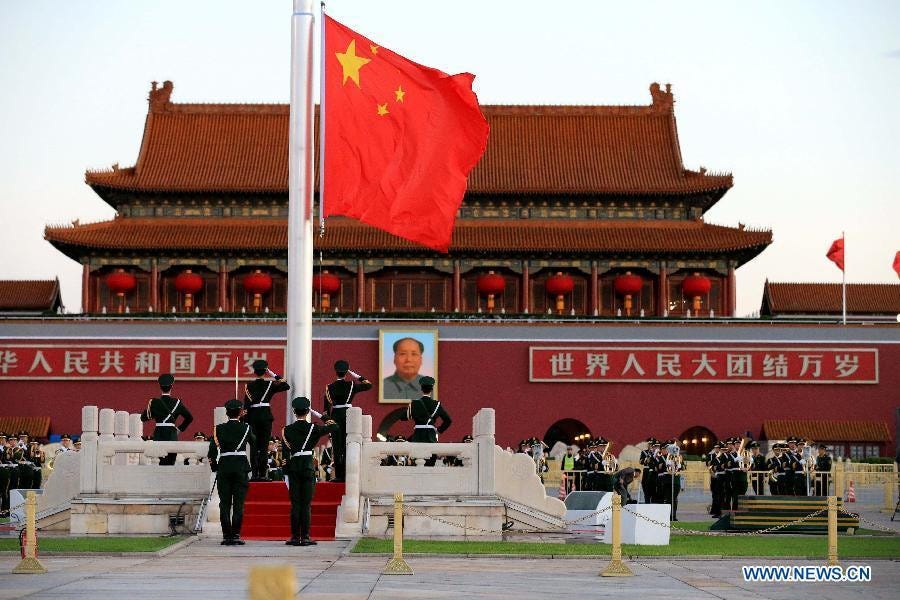 A national flag-raising ceremony is held at the Tiananmen Square to mark the 66th anniversary of the founding of the People's Republic of China on the National Day in Beijing, Oct 1, 2015.