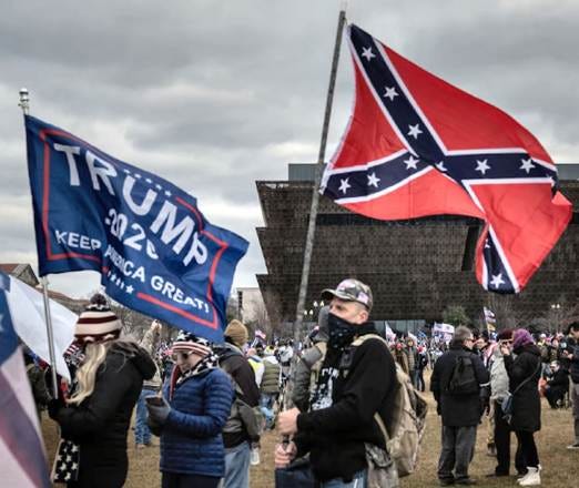 A group of people holding flags

AI-generated content may be incorrect.