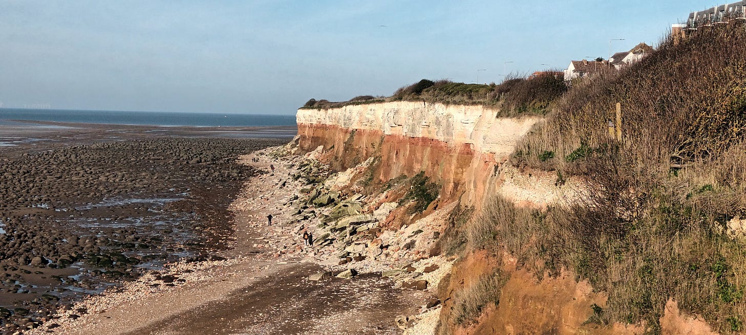 Two tone chalk cliffs, red at the bottom and white at the top