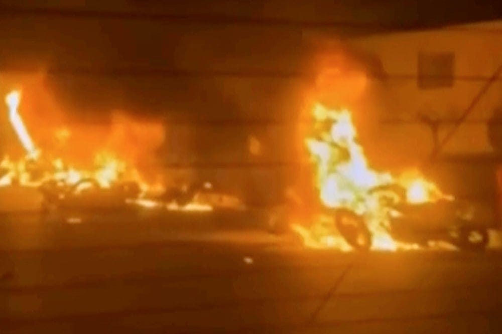 This frame grab from a video released by Iran state TV shows vehicles burning amid night of mass protests in Tehran, Iran, Thursday, Jan. 8, 2026 (AP)