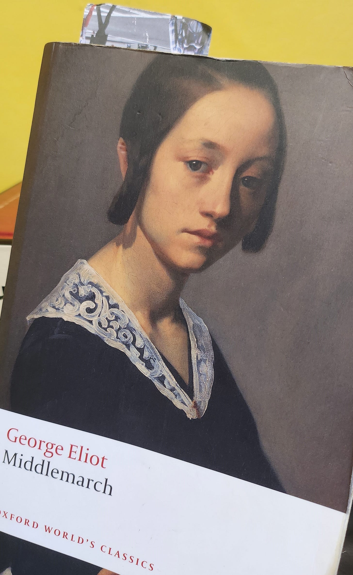 A photo of a copy of the Oxford World's Classics Edition of Middlemarch, with a bookmark sticking out that's about halfway through