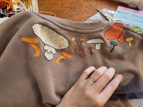 3 pictures of craft projects, a knitted jumper, a crochet blanket, and an embroidered jumper.