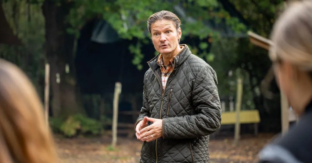 Giles Hutchins addressing a crowd on his woodland
