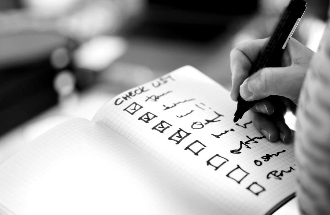 Someone is checking items off a checklist. Someone is checking items off a checklist.