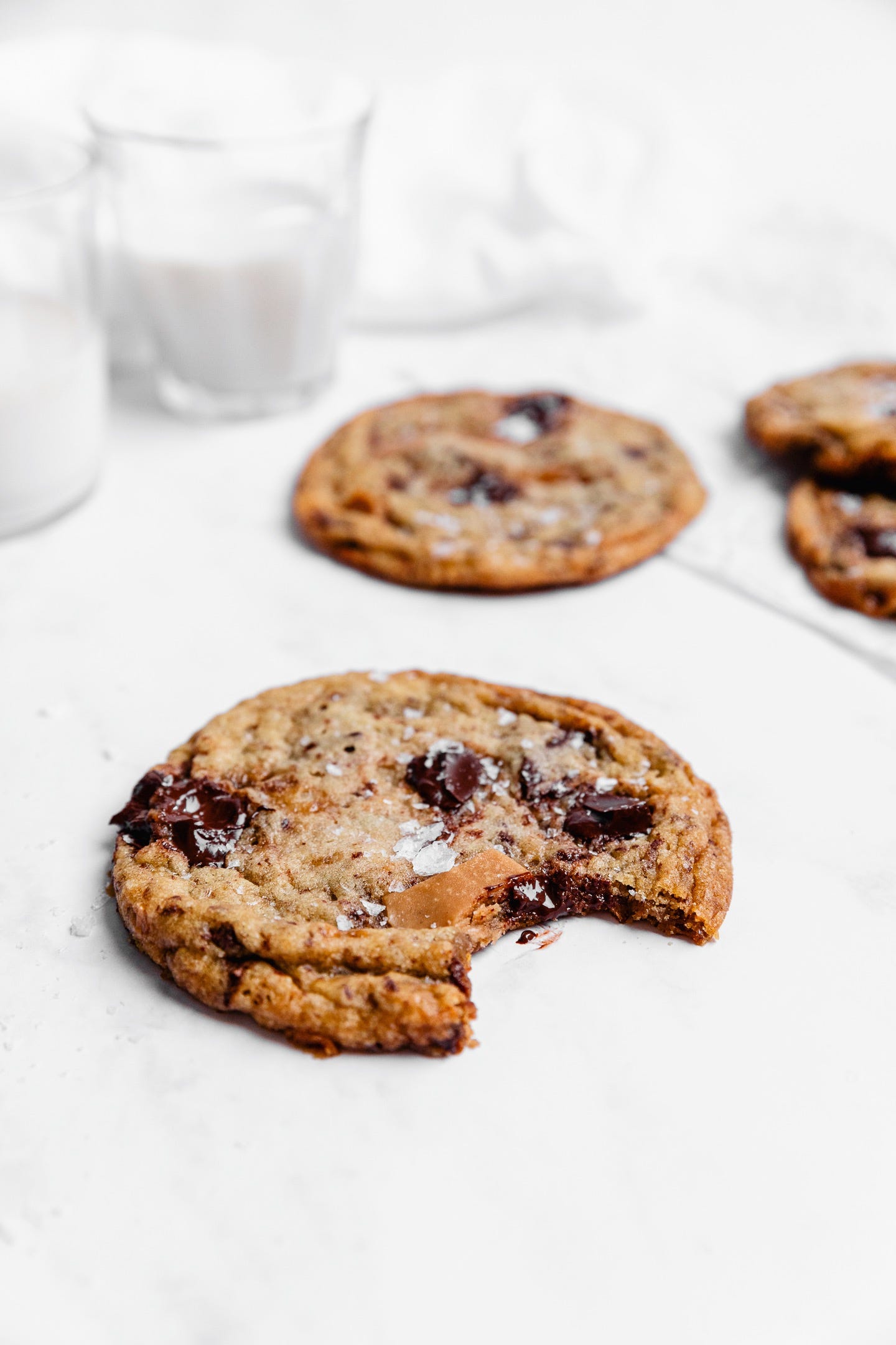 Vegan toffee chocolate chunk cookies on white background