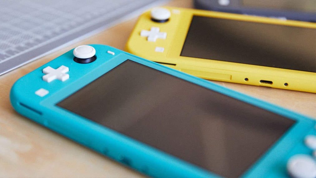 Two Nintendo Switch Lites lying on a table