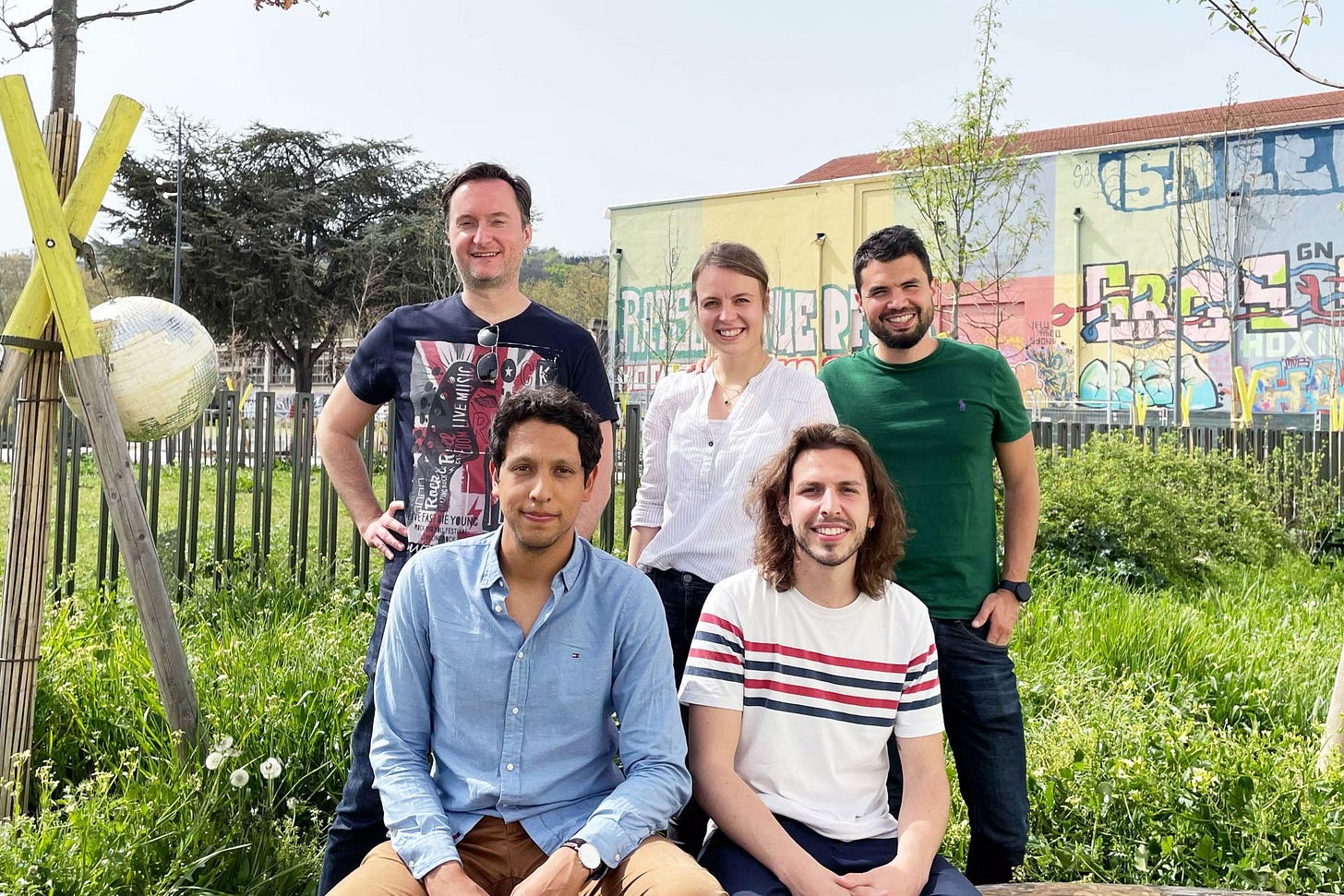 a group of people posing for the camera
