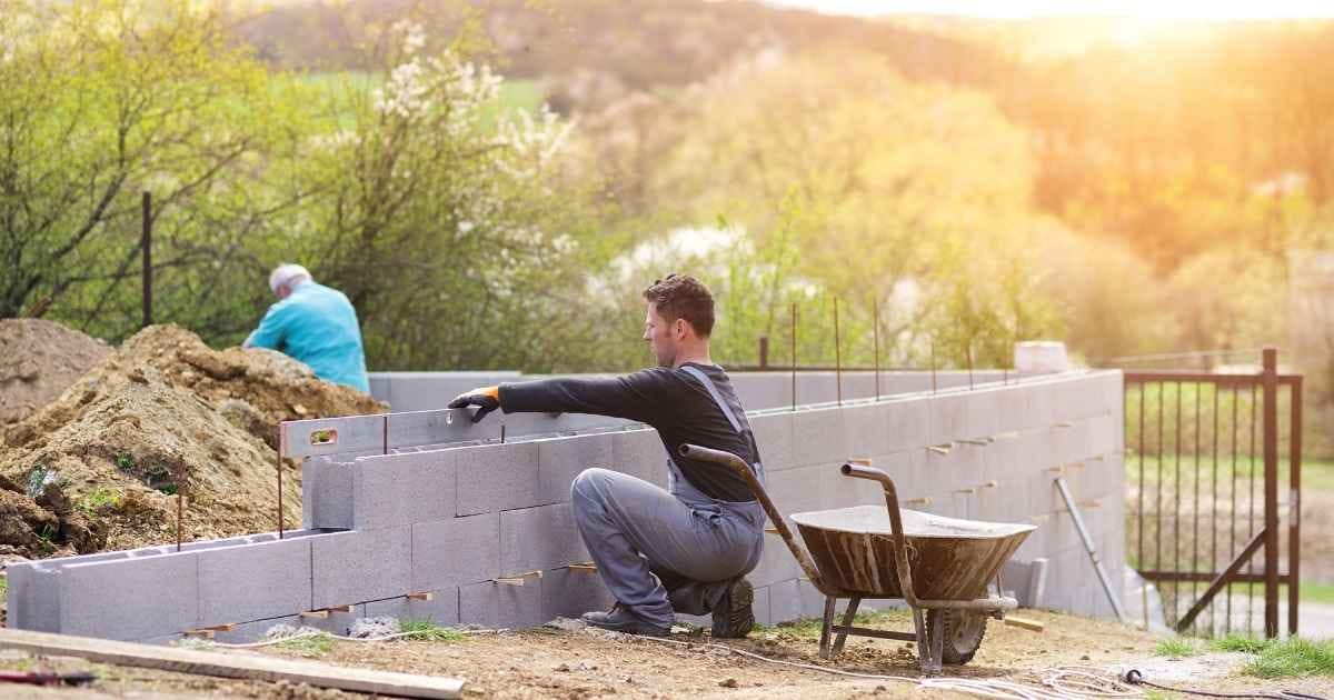 man building a house