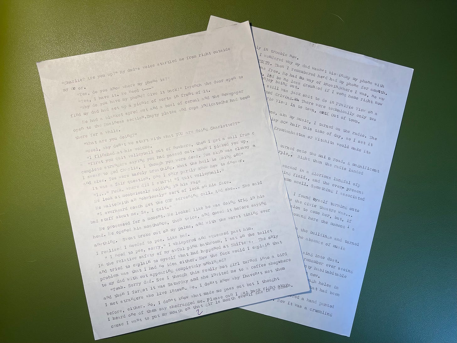 Two messy typewriter pages on a green background Two messy typewriter pages on a green background