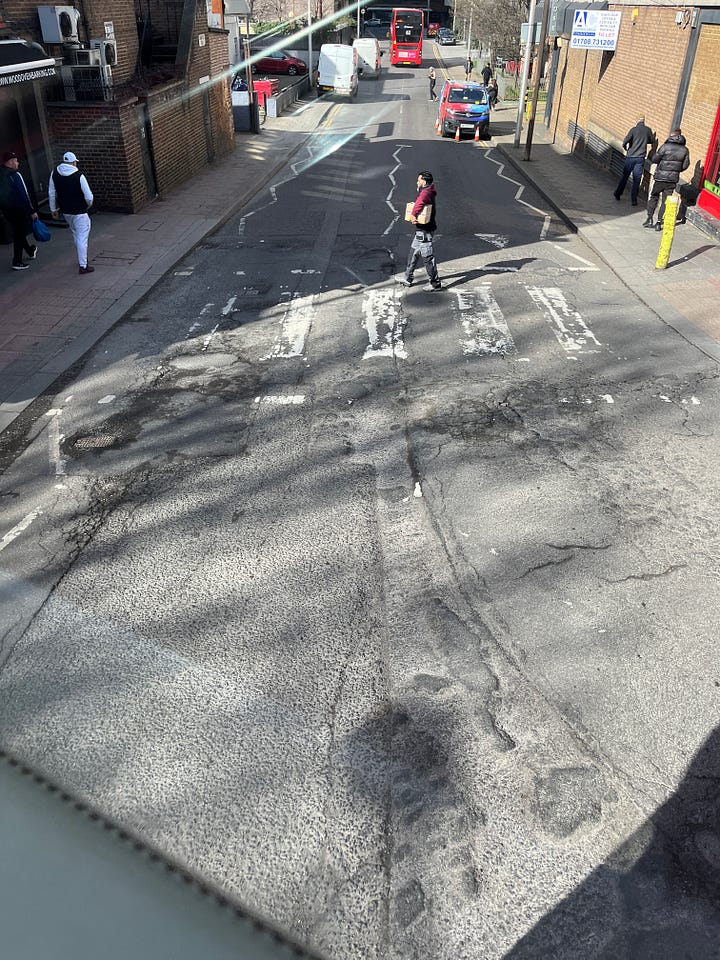 Photos showing the road surface around Barking station and a "Funded by UK Government" flag.