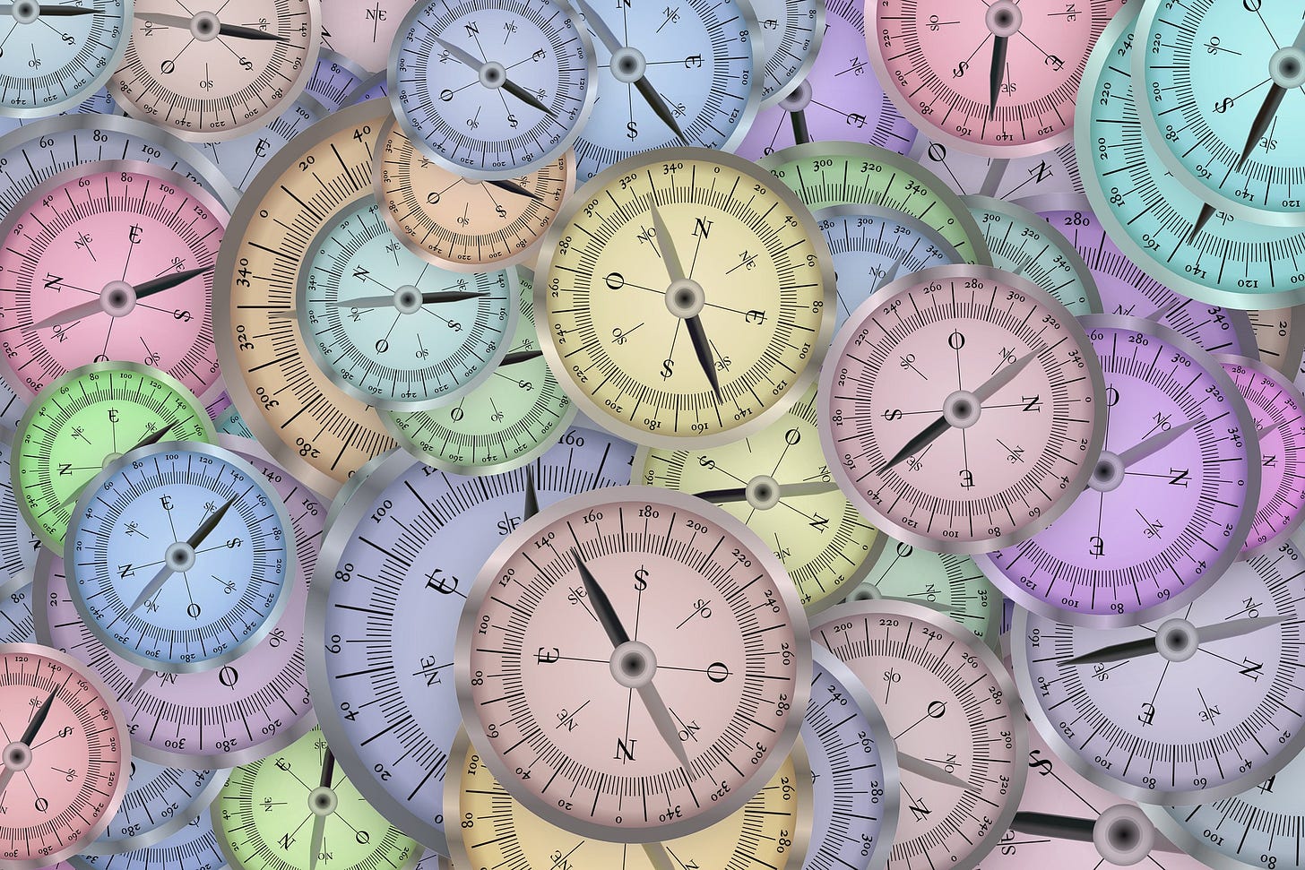 A group of different colored compasses. A group of different colored compasses.