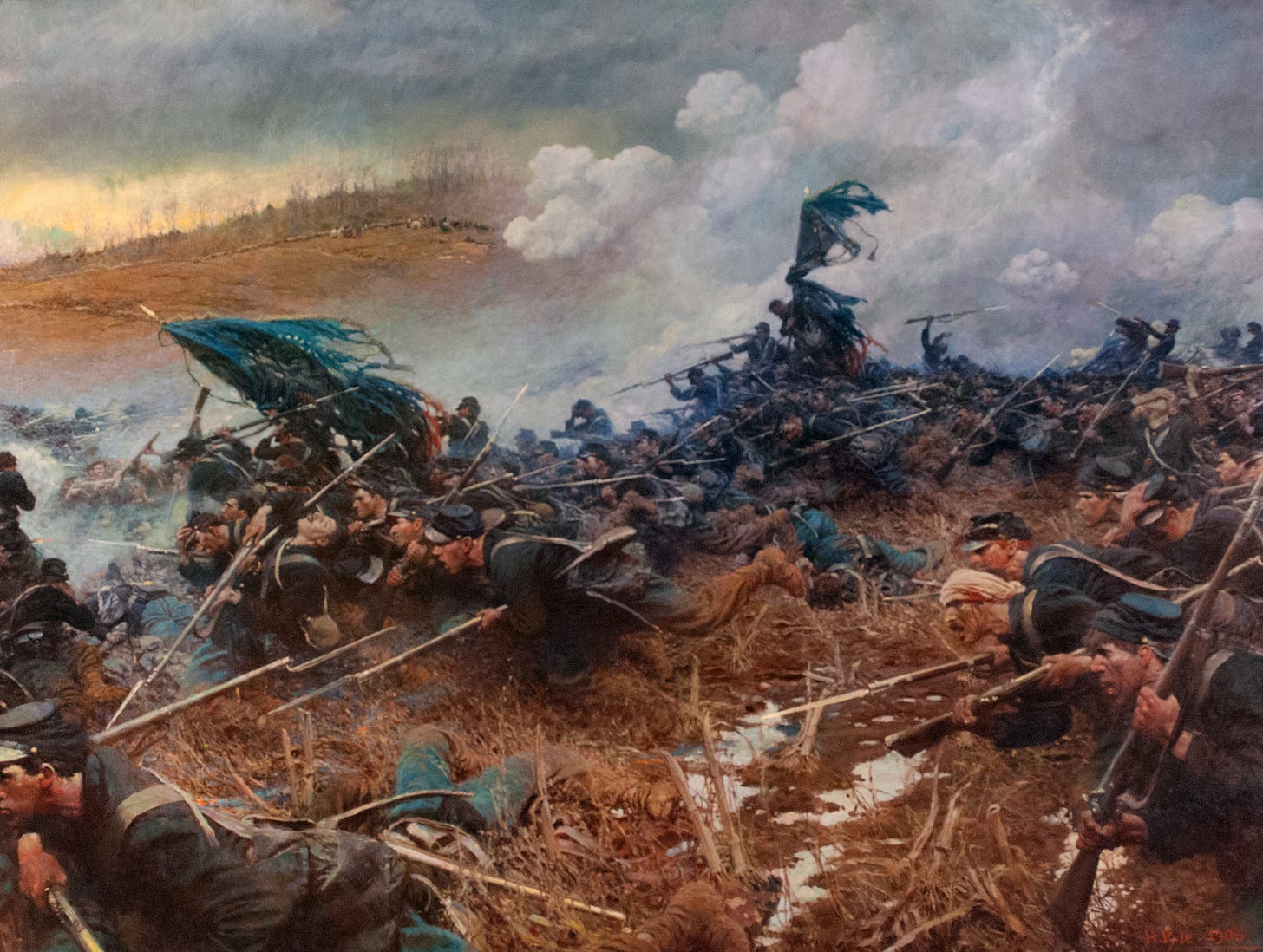 Union soldiers charging across the battlefield at Nashville