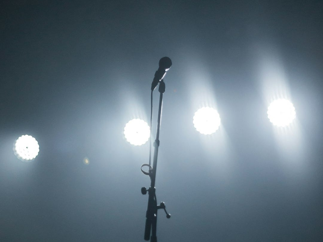 black microphone with stand