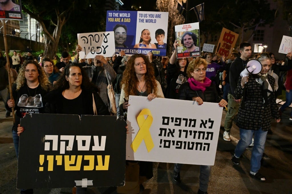 Friends and relatives of Israeli hostages held in Gaza protest in Tel Aviv