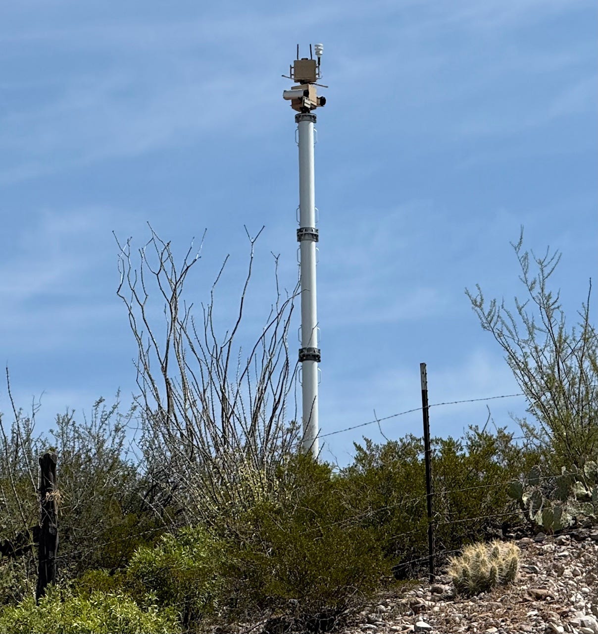 A tall metal tower with a blue sky

AI-generated content may be incorrect.