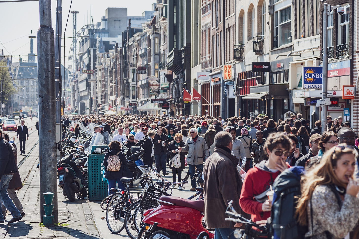 A crowded street full of people.