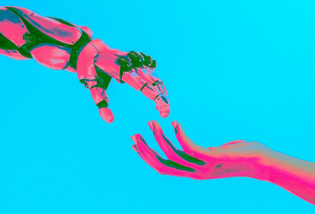 two hands reaching for a flying object in the sky