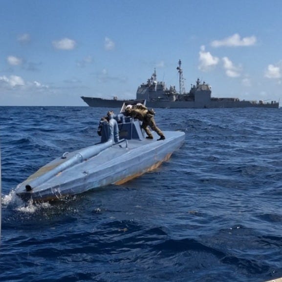 A US Coast Guard Law Enforcement Detachment - like the one seen here boarding a drug smuggling vessel will be aboard the Spruance.