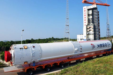 The first-stage and fairing of the Long March 6A heading to Launch Complex 9A.