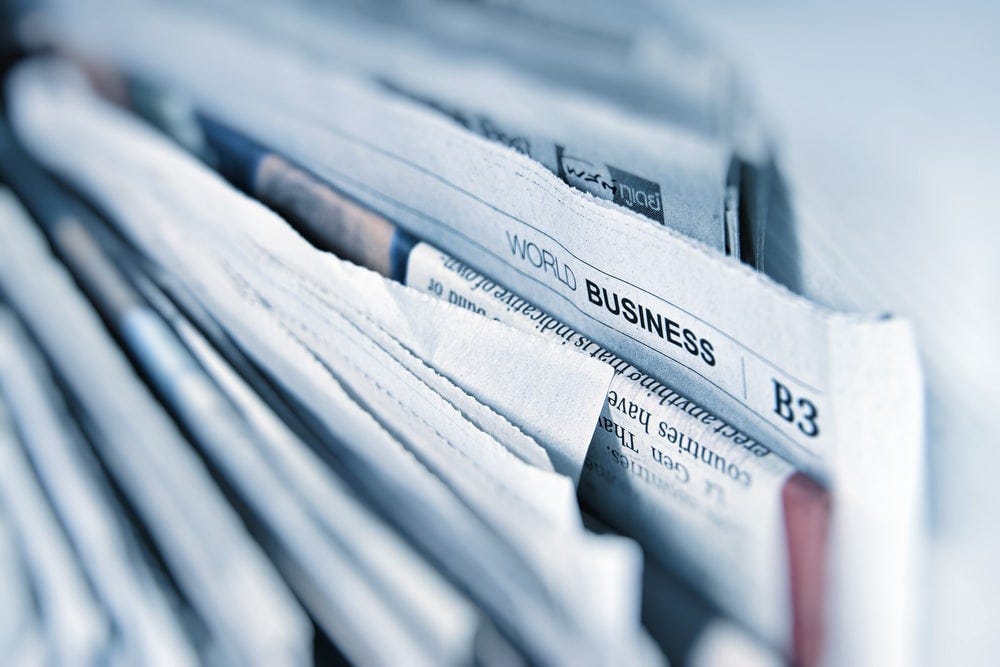 Business newspaper article Business newspaper article