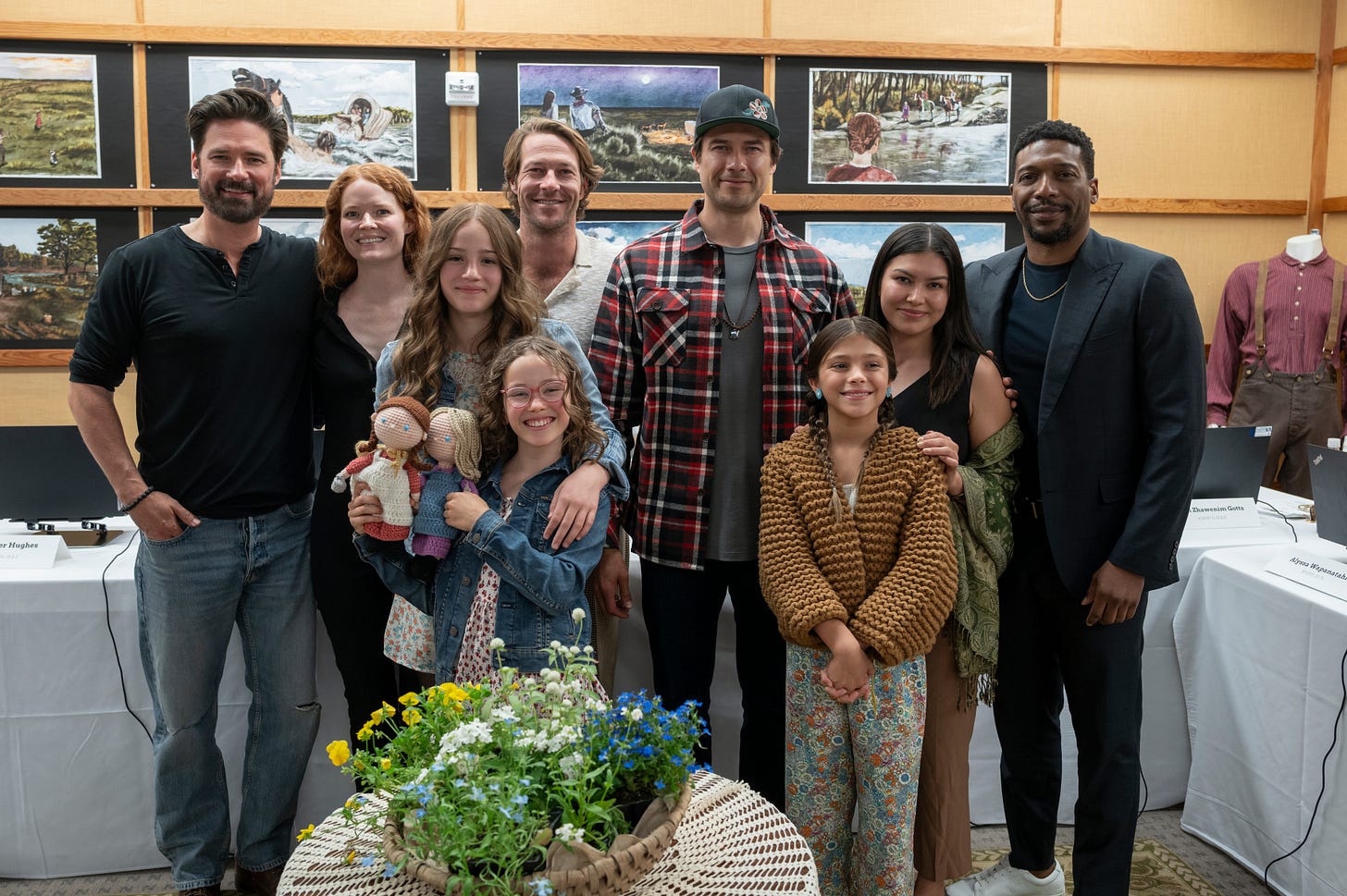 Little House on the Prairie. (L to R) Warren Christie as John Edwards, Crosby Fitzgerald as Caroline Ingalls, Skywalker Hughes as Mary Ingalls, Alice Halsey as Laura Ingalls, Luke Bracey as Charles Ingalls, Meegwun Fairbrother as Mitchell, Wren Zhawenim Gotts as Good Eagle, Alyssa Wapanatǎhk as White Sun, Jocko Sims as Dr. George Tann at the table read of Little House on the Prairie. Cr. Eric Zachanowich/Netflix © 2025 Little House on the Prairie. (L to R) Warren Christie as John Edwards, Crosby Fitzgerald as Caroline Ingalls, Skywalker Hughes as Mary Ingalls, Alice Halsey as Laura Ingalls, Luke Bracey as Charles Ingalls, Meegwun Fairbrother as Mitchell, Wren Zhawenim Gotts as Good Eagle, Alyssa Wapanatǎhk as White Sun, Jocko Sims as Dr. George Tann at the table read of Little House on the Prairie. Cr. Eric Zachanowich/Netflix © 2025