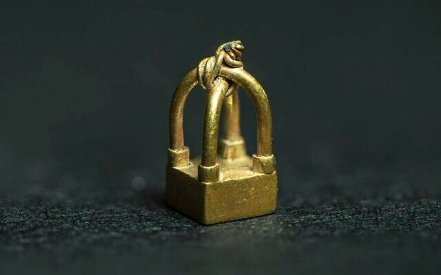Tiny, 3,000-year-old gold pendant found in the Ophel area in Jerusalem, thought to be of Phoenician origin. (courtesy AIBA/Reese Zoellner)