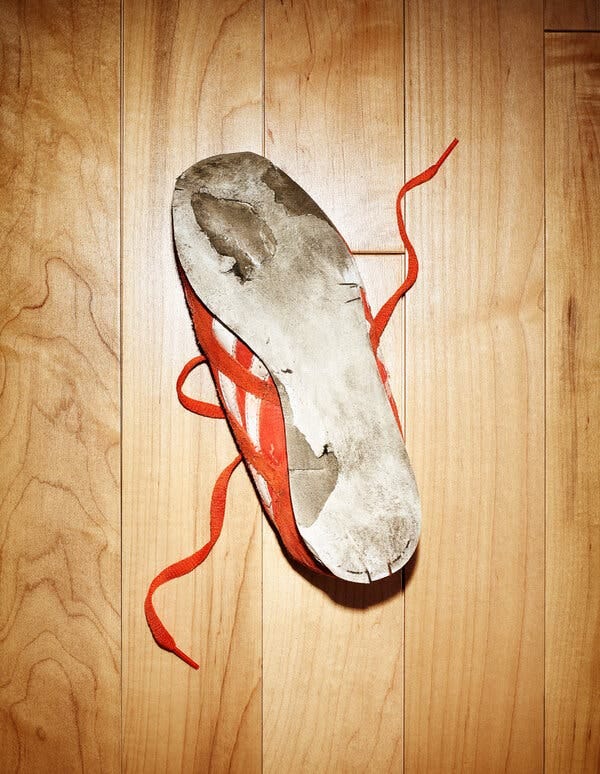 A photo of a worn out sneaker sole. A photo of a worn out sneaker sole.